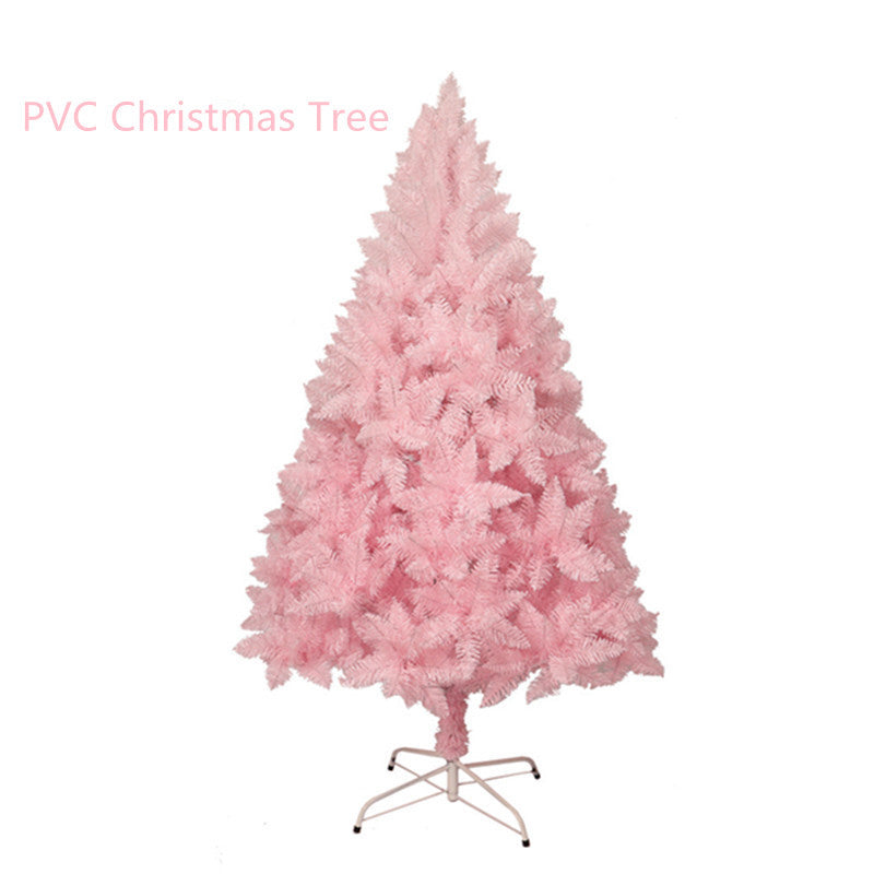 Pink PVC artificial Christmas tree with dense branches and metal stand on white background