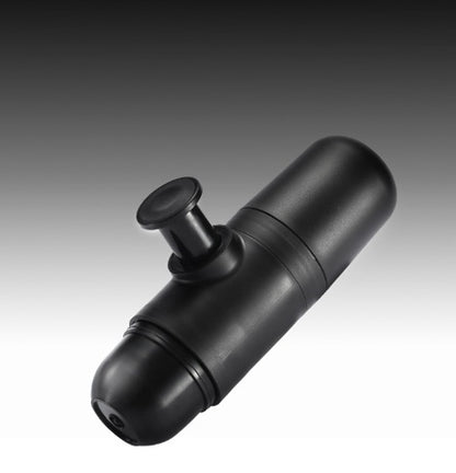 Compact black manual device with a plunger mechanism against a gradient background