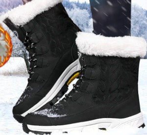 Black winter snow boots with white fur lining and sturdy soles in snowy outdoor setting