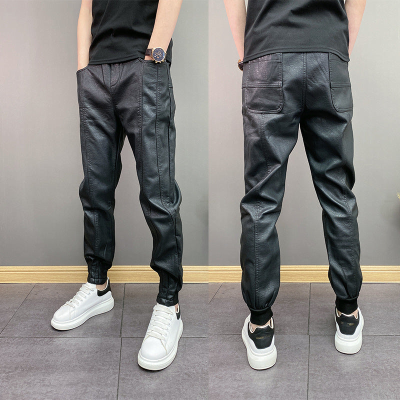 Front and back view of man wearing black faux leather jogger pants with pockets and white sneakers