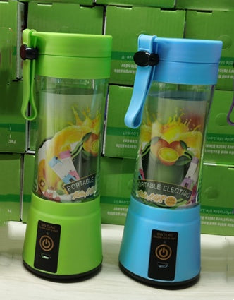 Green and blue portable electric blenders with fruit graphics on transparent containers