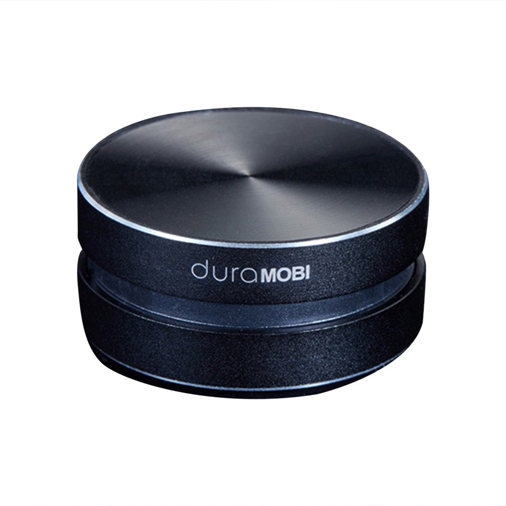 Black round duraMOBI Bluetooth speaker with metallic top on white background