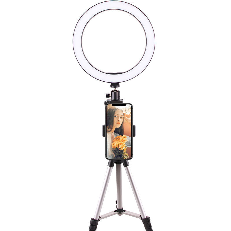 Ring light with adjustable tripod stand and smartphone holder displaying woman with flowers