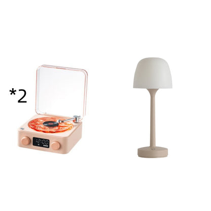 Beige retro turntable with pizza vinyl and modern beige table lamp on white background