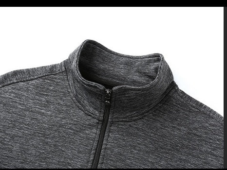Close-up of dark gray heather quarter-zip pullover collar with black zipper