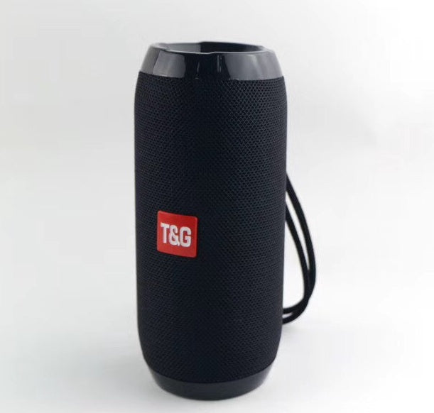 Black portable T&G Bluetooth speaker with mesh body and wrist strap on white background