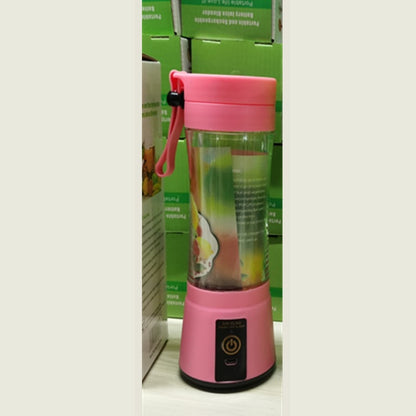 Portable pink blender with handle strap, clear container, power button, and charging port