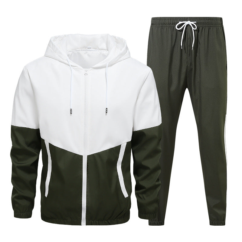 Two-piece men's activewear set with white and dark green zip hoodie and matching jogger pants