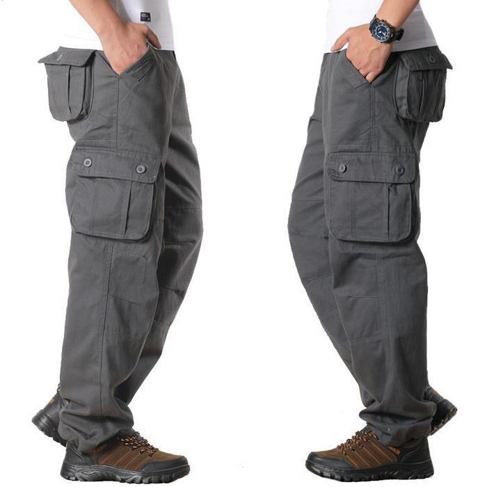 Men's gray cargo pants with multiple pockets worn with brown hiking shoes and white t-shirt