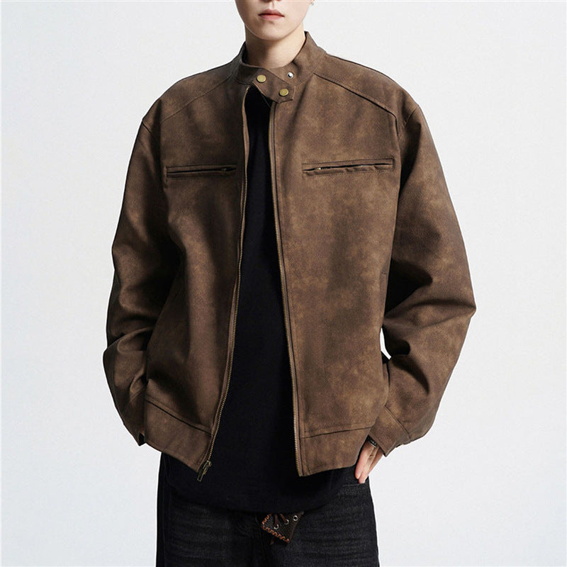 Man wearing brown suede biker jacket with zipper and snap collar over black shirt