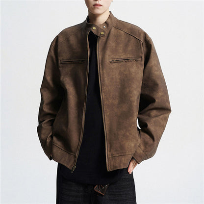 Man wearing brown suede biker jacket with zipper and snap collar over black shirt