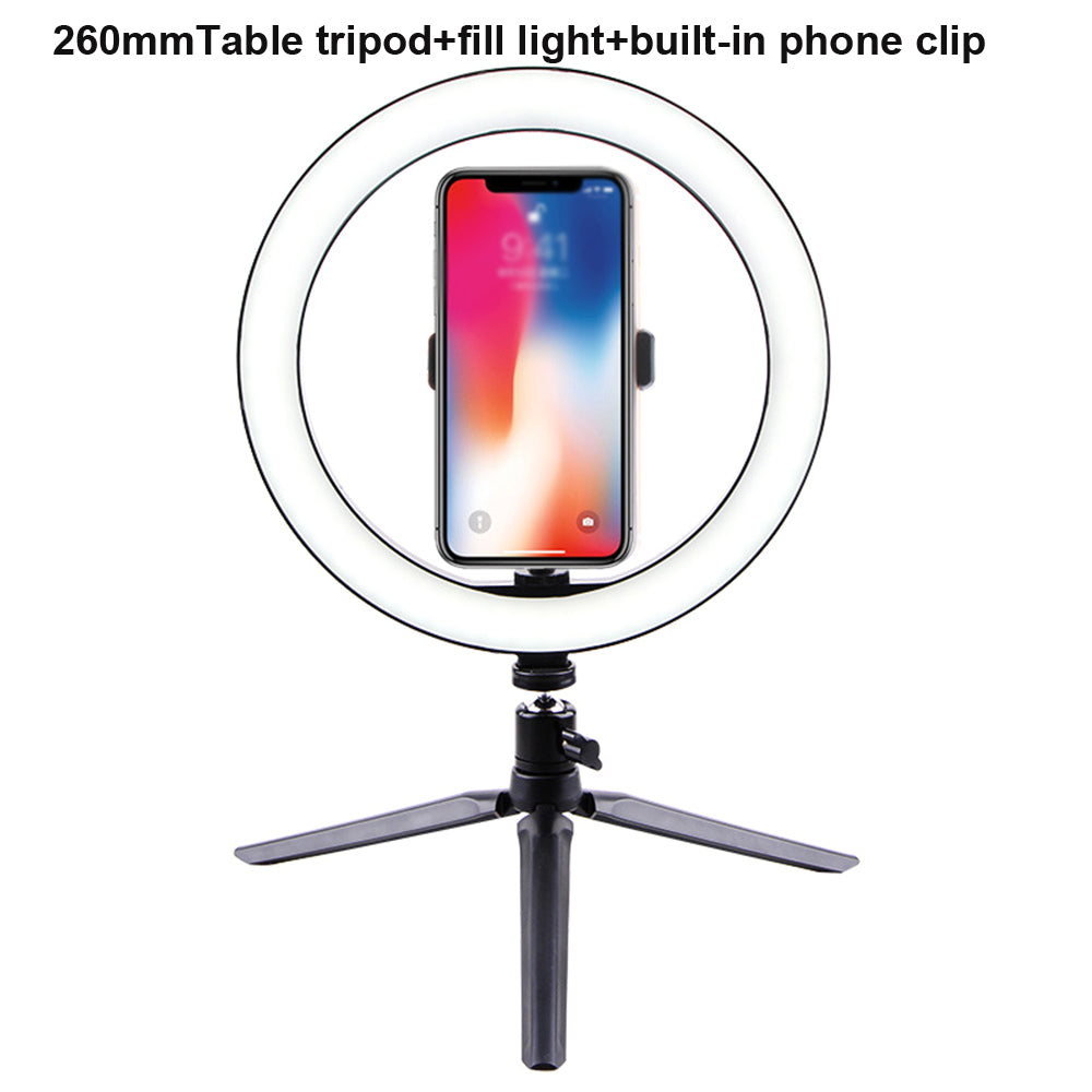 260mm table tripod with adjustable fill light and built-in phone clip holding smartphone