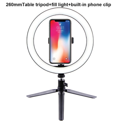 260mm table tripod with adjustable fill light and built-in phone clip holding smartphone
