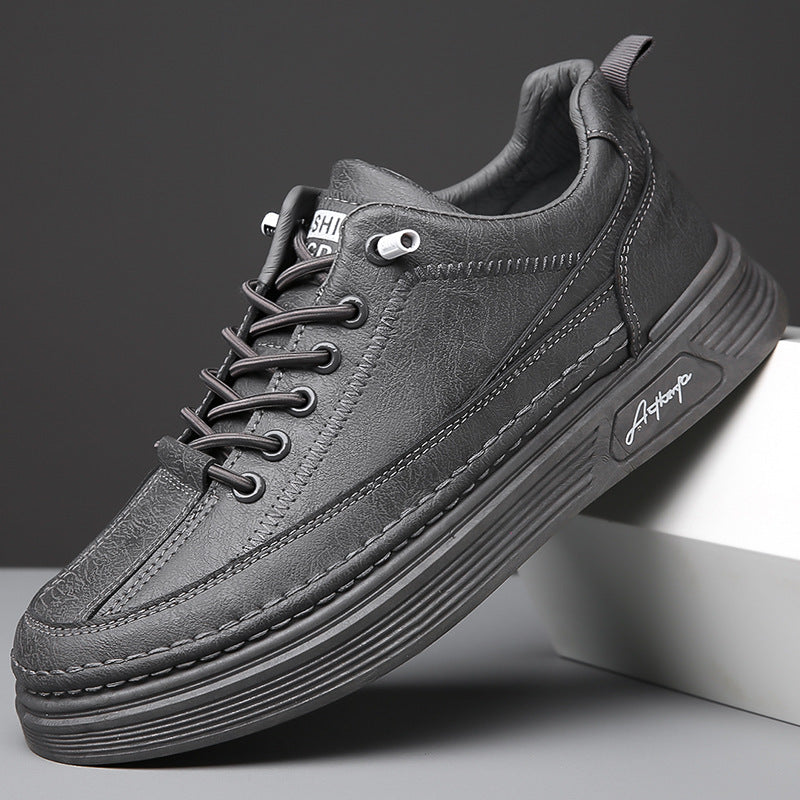 Close-up of stylish black leather casual sneaker with detailed stitching and thick ribbed sole
