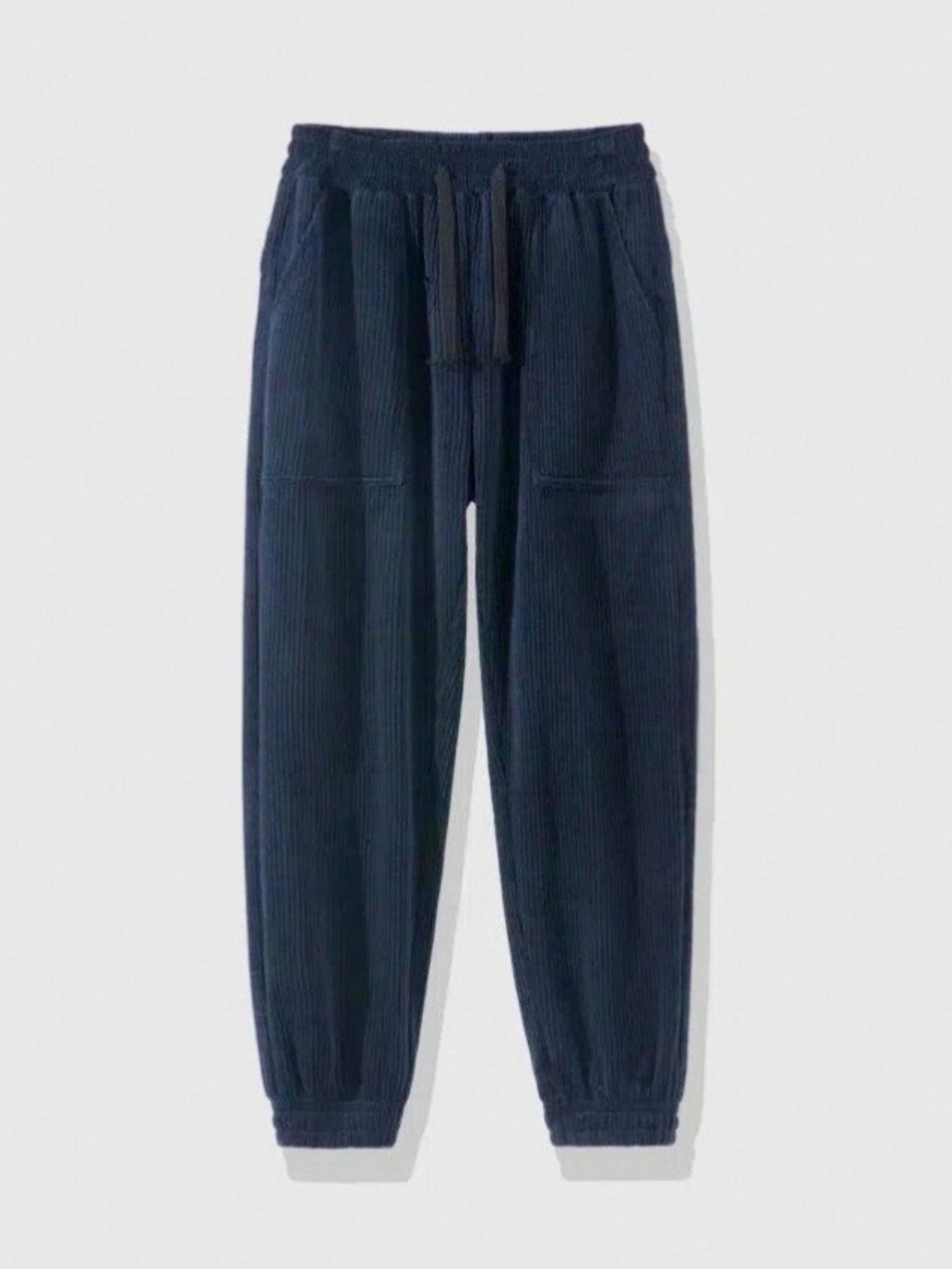 navy blue corduroy jogger pants with elastic waistband and cuffed ankles