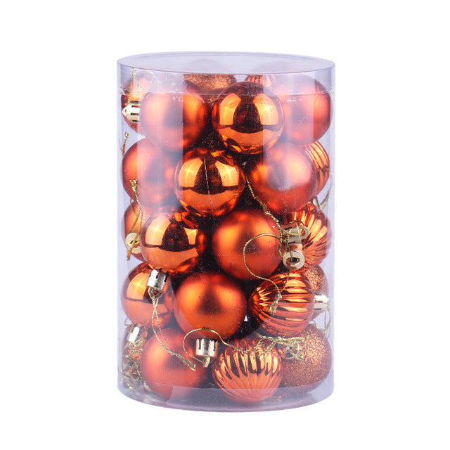 Clear plastic container filled with shiny and matte orange Christmas ornaments