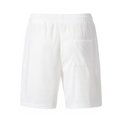 White ribbed terry cloth shorts with elastic waistband and side pocket