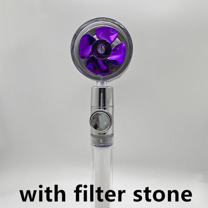 modern handheld shower head with purple fan blades and filter stone feature on white background