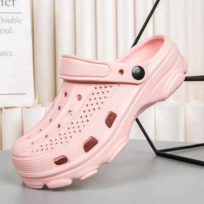 Light pink ventilation clog shoe with strap and textured sole on modern display
