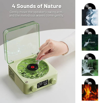 Hand adjusting green nature sound speaker with vinyl record and 4 sounds: waves, birds, stream, fire