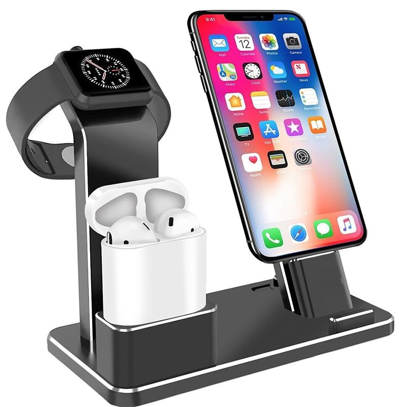 Black multi-device charging station holding smartwatch, wireless earbuds, and smartphone