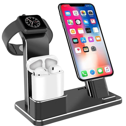 Black multi-device charging station holding smartwatch, wireless earbuds, and smartphone