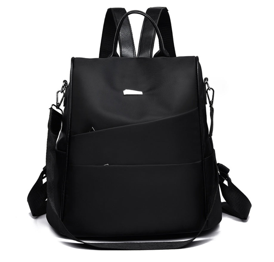 Black modern backpack with dual shoulder straps and detachable crossbody strap on white background