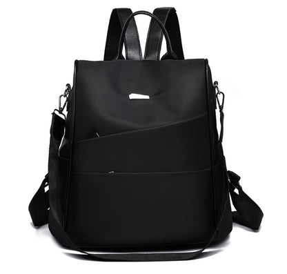 Black modern backpack with dual shoulder straps and detachable crossbody strap on white background