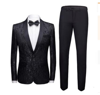 Men's black floral jacquard tuxedo jacket with satin lapels and matching black dress pants, white shirt, and bow tie