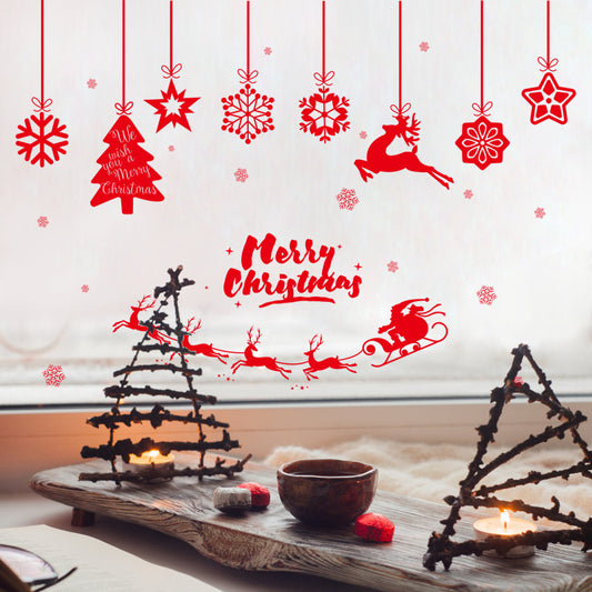 Cozy Christmas decor with twig Christmas tree candle holders, hot drink, and red festive window stickers