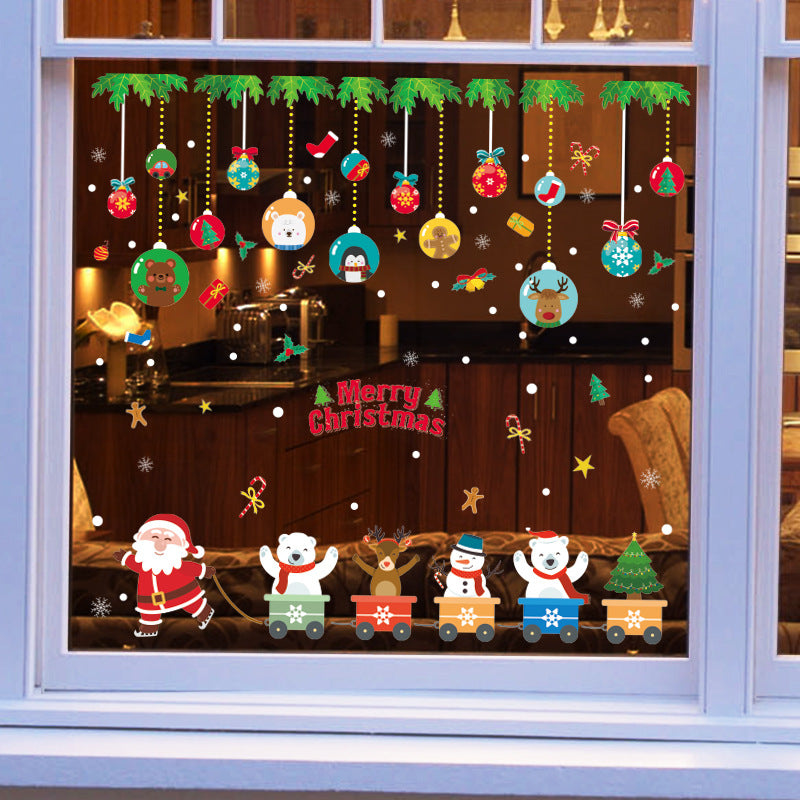 Christmas window decals with Santa pulling festive train of bear, reindeer, snowman, and tree, colorful hanging ornaments