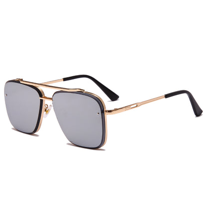 Square gray lens sunglasses with gold metal frame and black temple tips on white background
