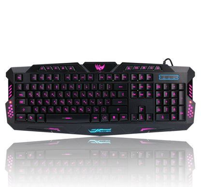 Black wired gaming keyboard with pink backlit keys and gaming logo on top center