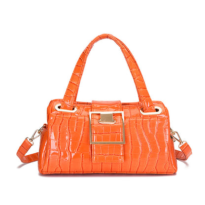 Orange croc-texture handbag with top handles, gold buckle detail, and detachable strap