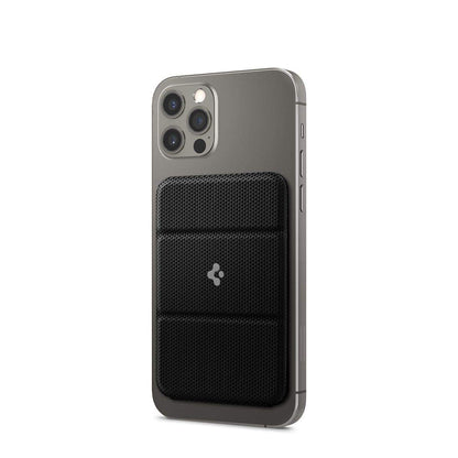 Gray smartphone with triple camera and black textured magnetic cardholder attached to back