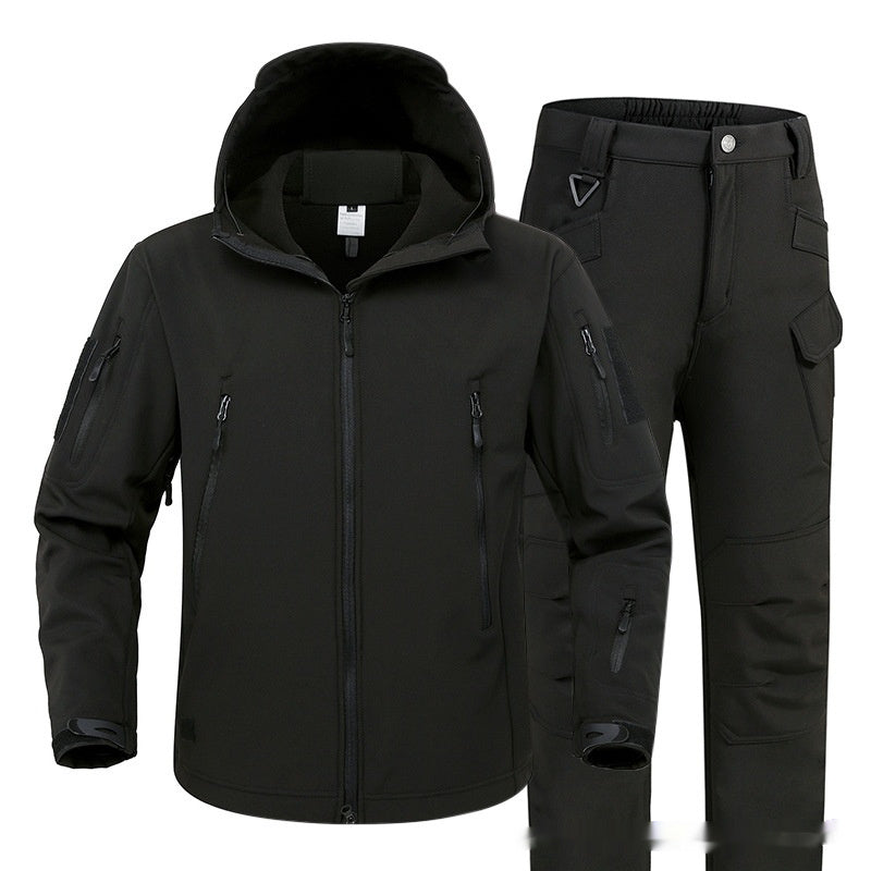 Black tactical softshell jacket with hood and black cargo pants with multiple pockets