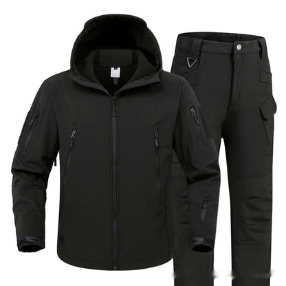 Black tactical softshell jacket with hood and black cargo pants with multiple pockets