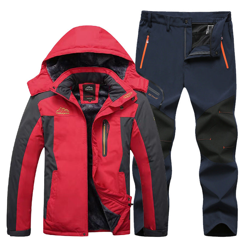 Red and black insulated outdoor jacket with hood and navy blue hiking pants with orange zippers