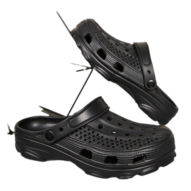 Pair of black ventilated slip-on clogs with adjustable heel straps on white background