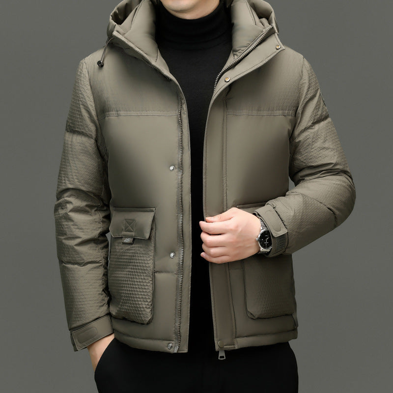 Men's khaki padded winter jacket with hood, textured sleeves and front pockets, worn over black turtleneck