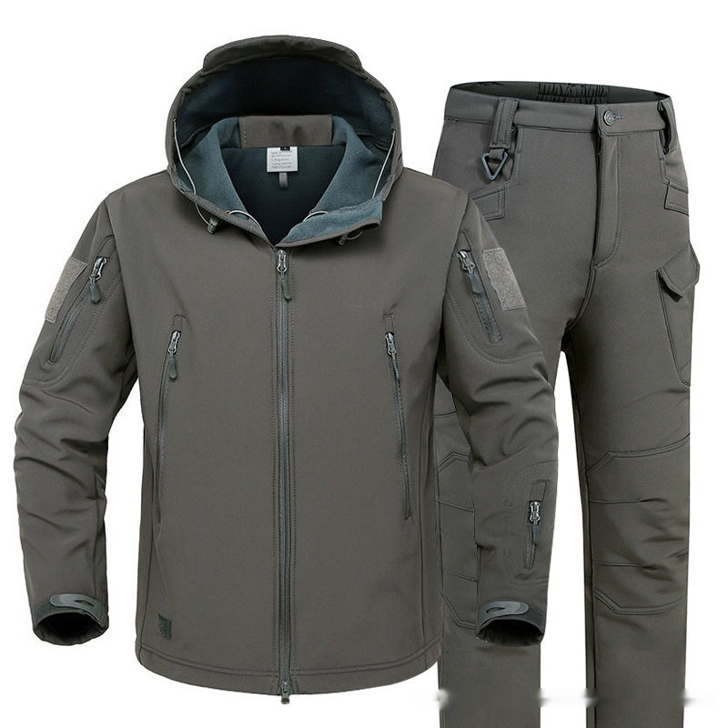 Gray hooded softshell jacket and tactical pants with multiple zippered pockets for outdoor activities