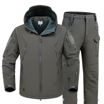 Gray hooded softshell jacket and tactical pants with multiple zippered pockets for outdoor activities