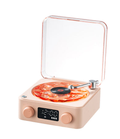 Beige turntable with clear lid and pizza slice design on the platter, digital clock display