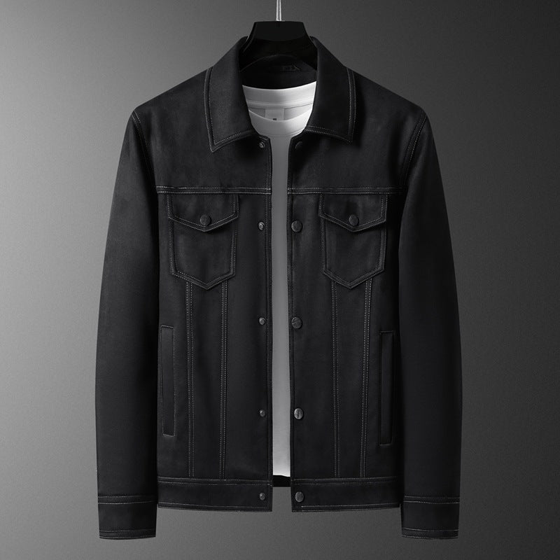 Black denim jacket with button front, flap chest pockets, on hanger over white t-shirt