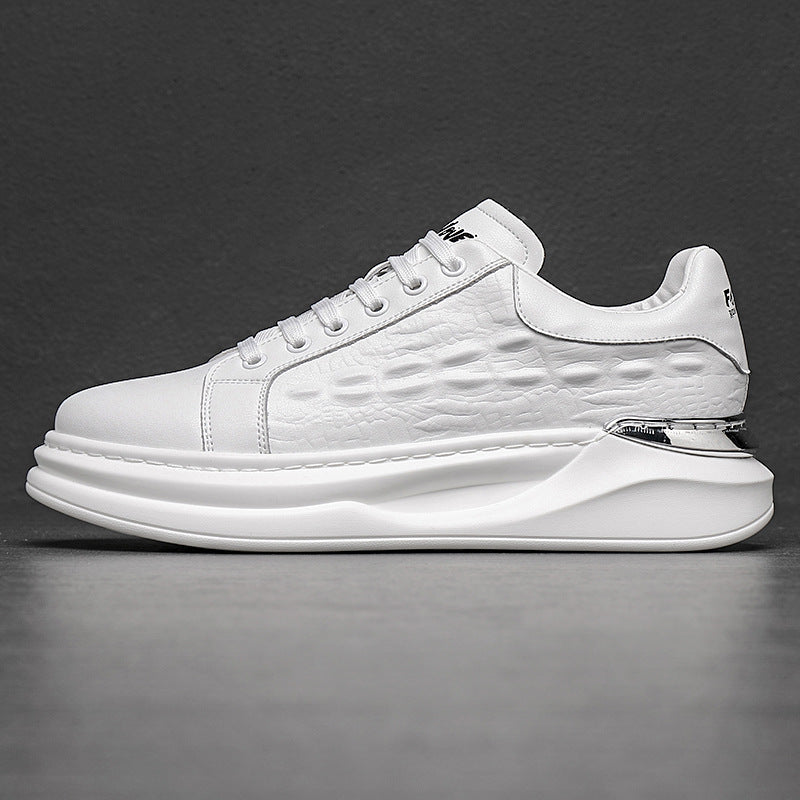 White men's fashion sneaker with textured side panel, thick sole, and metallic heel detail on gray background
