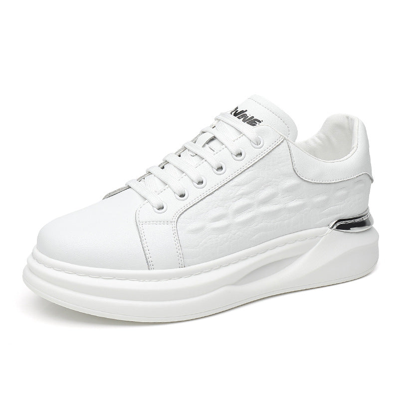 White leather sneaker with textured side panel, white laces, and chunky sole with silver accent