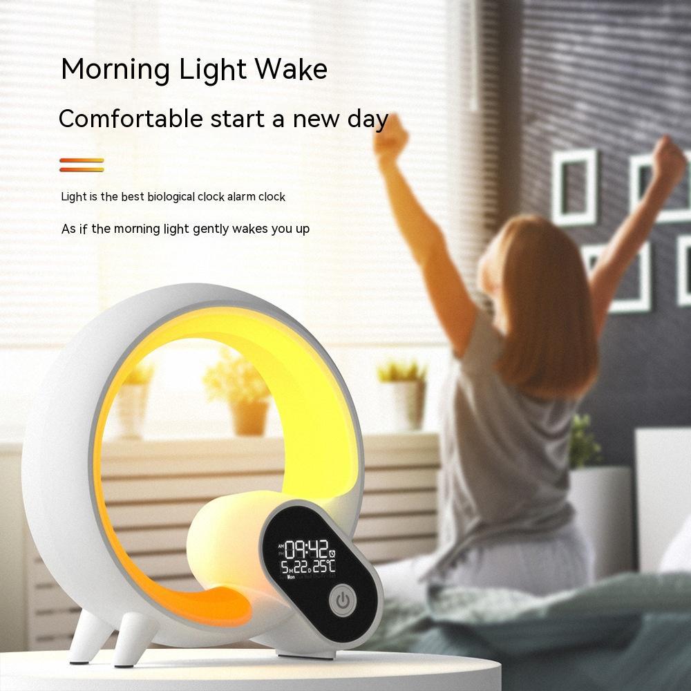 Modern circular LED alarm clock with digital display on table, woman stretching in bright bedroom