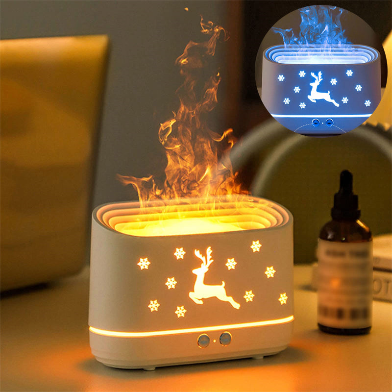 Holiday-themed humidifier with reindeer and snowflake cutouts glowing orange and blue emitting mist on table