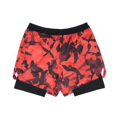Red and black abstract print athletic shorts with black inner compression layer and black waistband