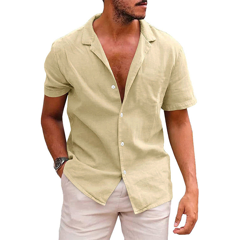 man wearing beige short-sleeve button-up linen shirt with pale pink shorts and wristwatch